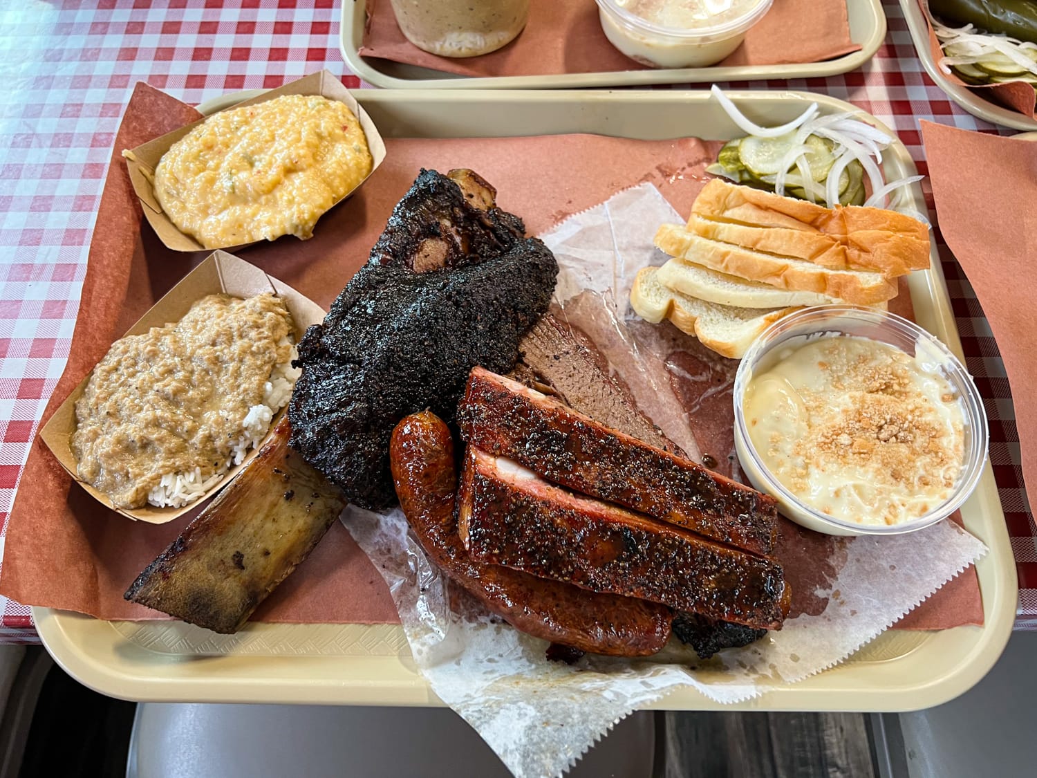 Goldee’s Barbecue signature dishes Brisket, Pork Ribs, Pork Belly.